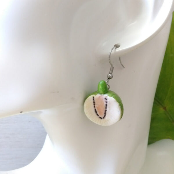 breadfruit earrings on ear