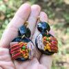 Puerto Rican artist hand with Christmas earrings