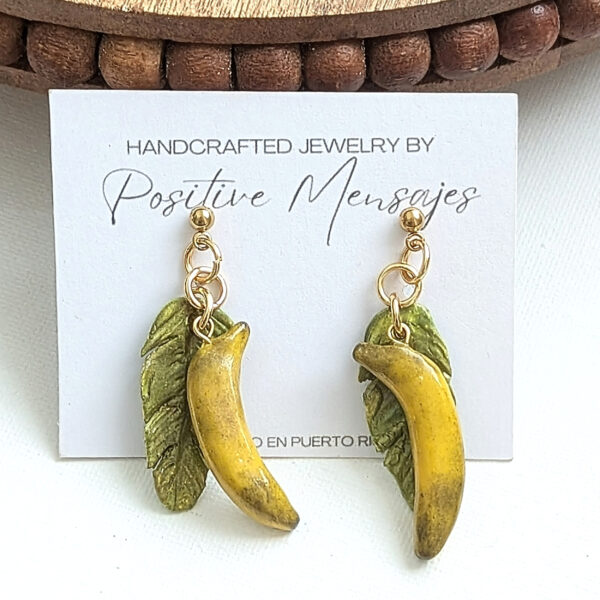 yellow plantain earrings with leaf on jewelry card