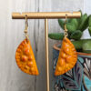 empanada earrings with succulent plant