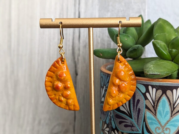 empanada earrings with succulent plant