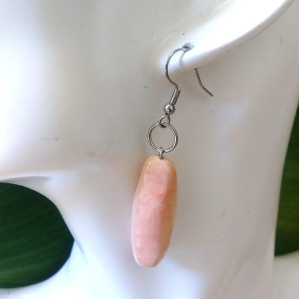 pan sobao earrings on ear