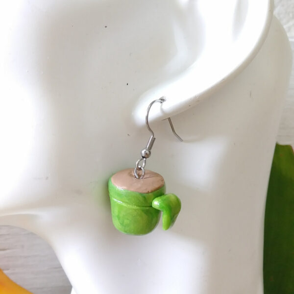 coffee cup earrings on ear