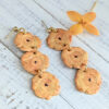 gold tostones earrings with yellow flower