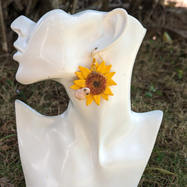 sunflower coqui earring on mannequin