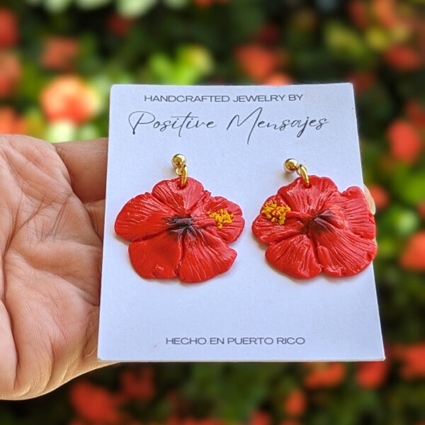 top view of red hibiscus flower earrings