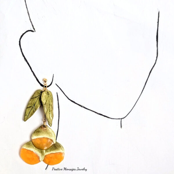 long fruit earrings on ear