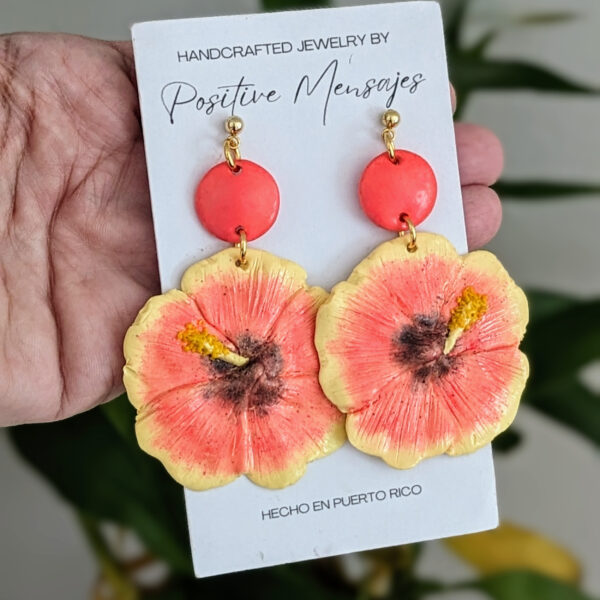 Puerto Rican hibiscus flower jewelry on bamboo leaves