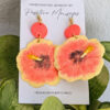 yellow pink hibiscus earrings on plant