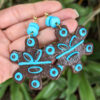 taino sun blue earrings on hand