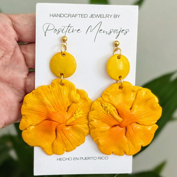 yellow hibiscus earrings on bamboo leaves