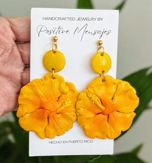 yellow hibiscus earrings on bamboo leaves