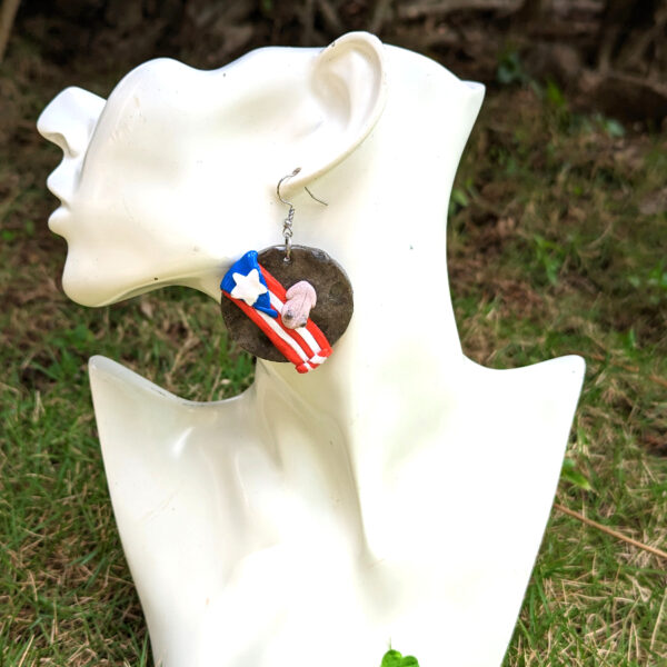 coqui flag earring on mannequin