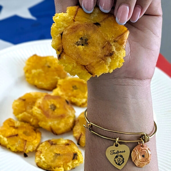 tostones bracelet with fried plantain on hand