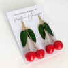 long cherry earrings on jewelry card