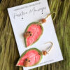 coqui on leaf earrings displayed on card