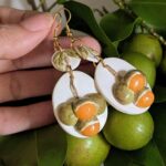 quenepa earrings on mamoncillo plant