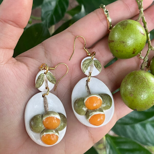 puerto rico fruit earrings next to quenepas