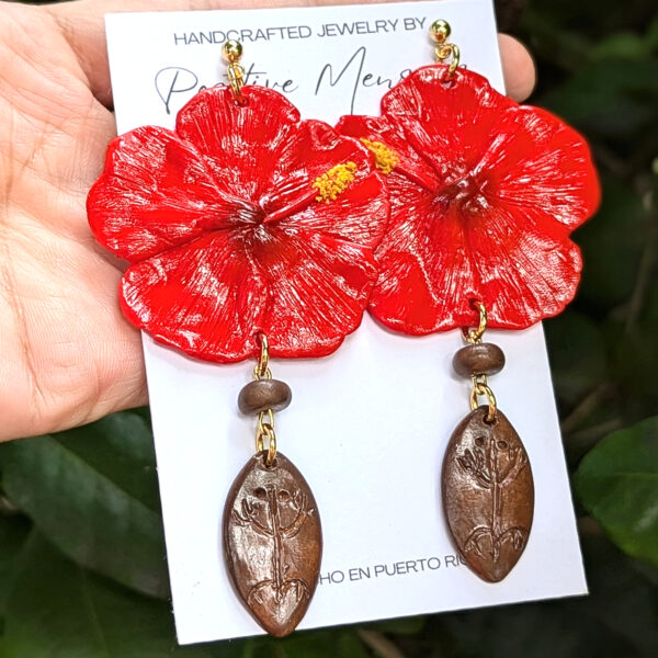 taino earrings on hand