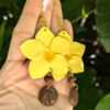 yellow flower earrings with taino coqui symbol