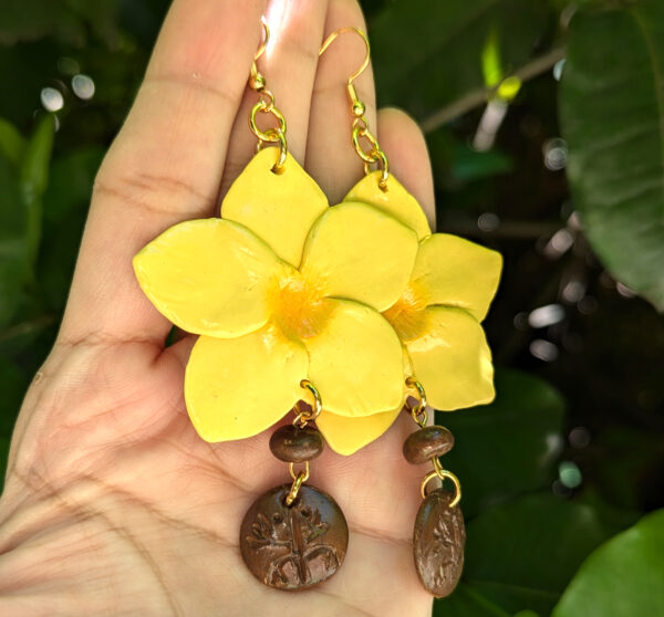 yellow flower earrings with taino coqui symbol