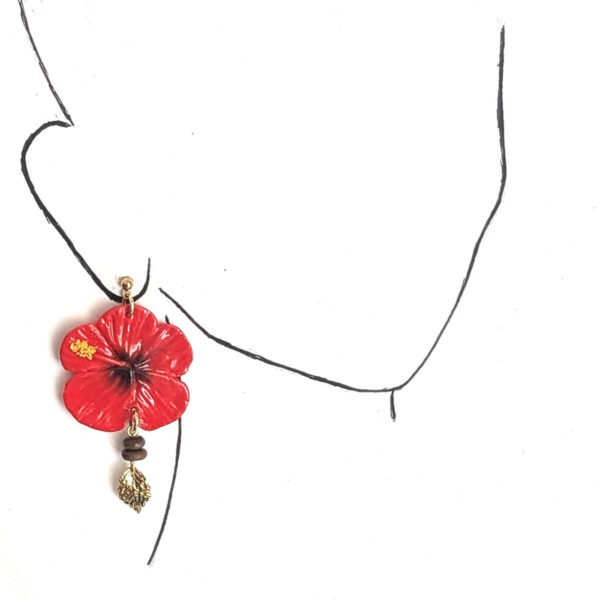 mini flor de maga earrings on ear