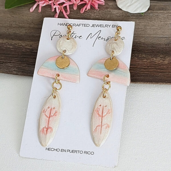 ocean inspired earrings with taino symbol