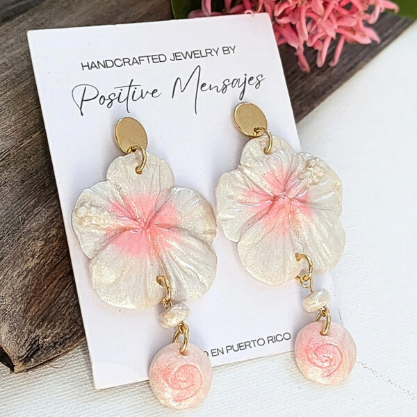 pearl white hibiscus earrings with taino symbol