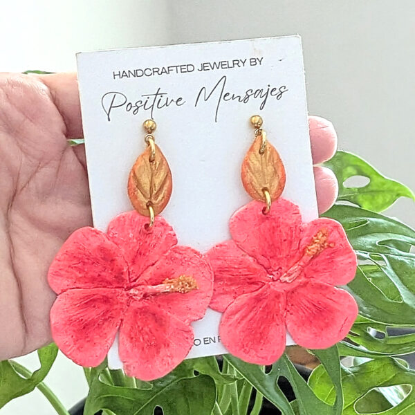 pink Flor de maga earrings on cheese plant