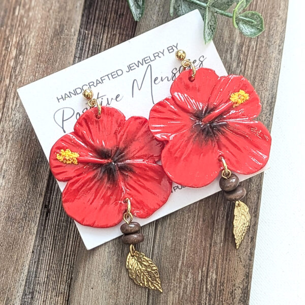 flor de maga earrings on white jewelry card
