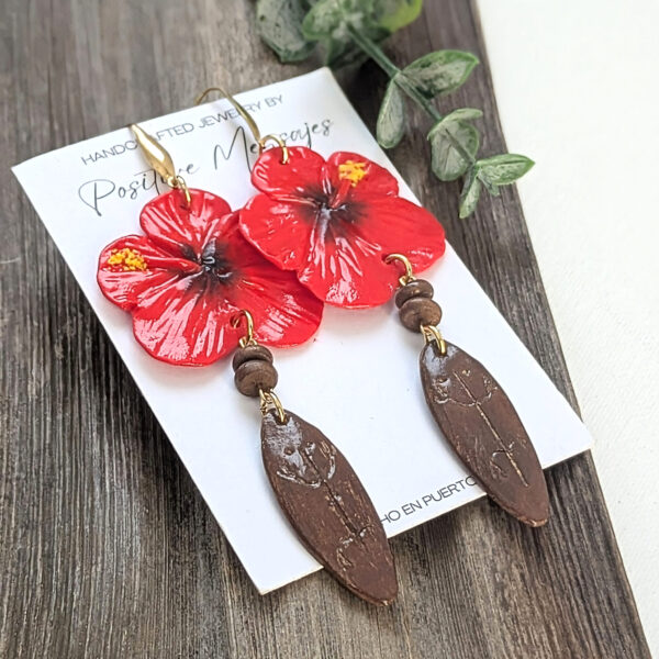 taino earrigns with long wooden pieces