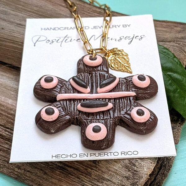 large taino sun necklace on wood