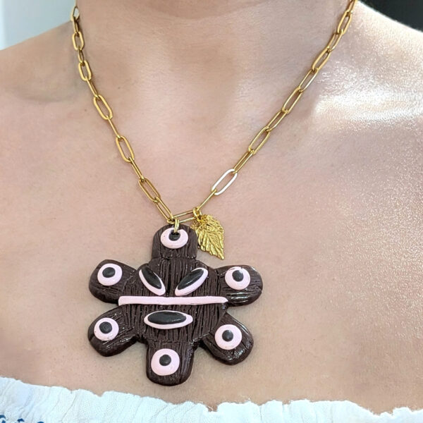 sol taino gold necklace on women