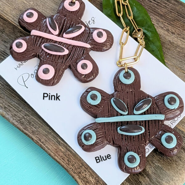 red and blue taino sun god necklaces