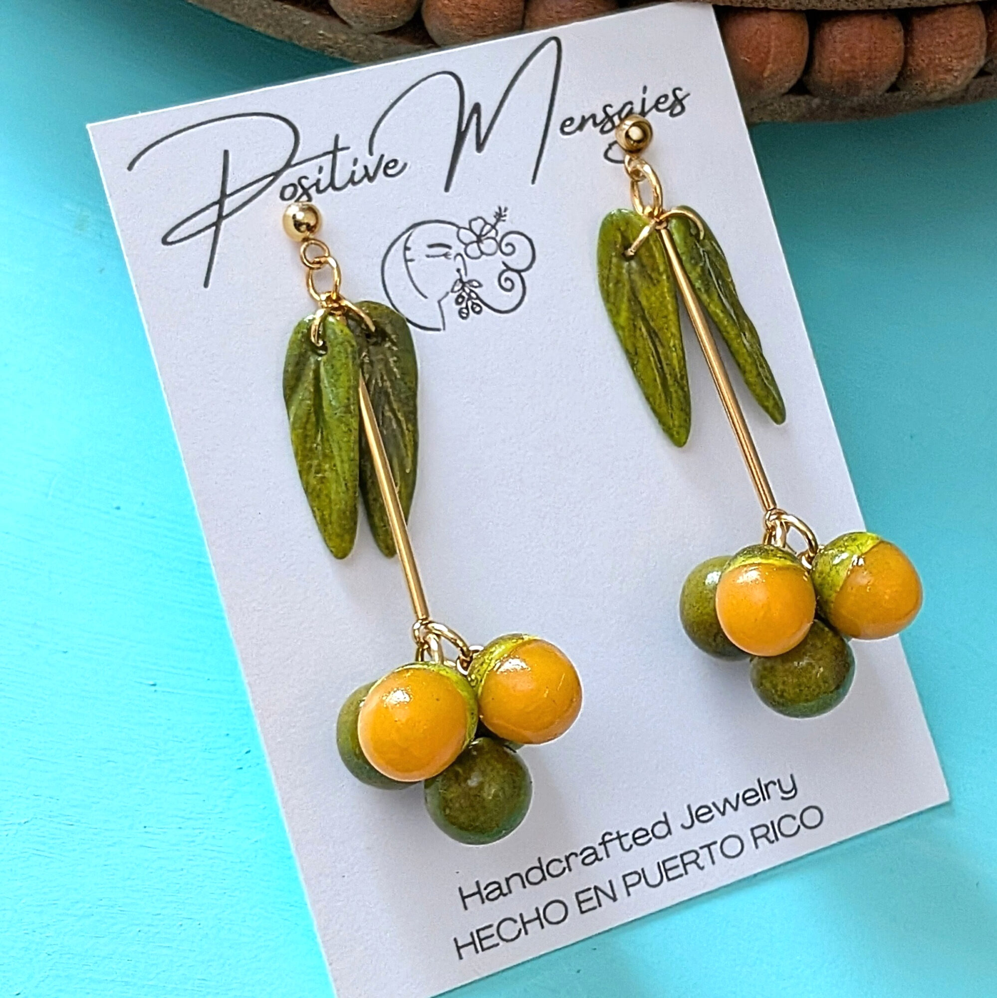 Left side of the gold quenepa earrings