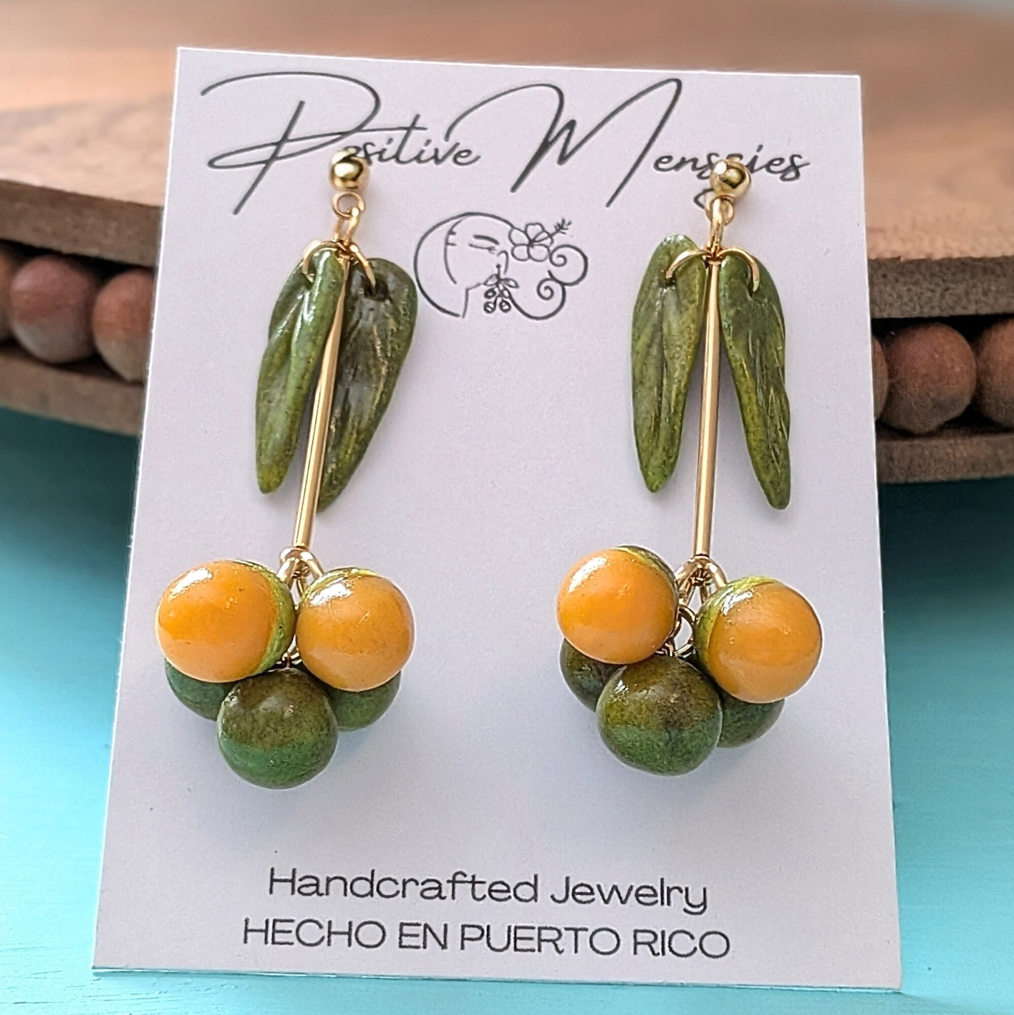 quenepa earrings on jewelry card