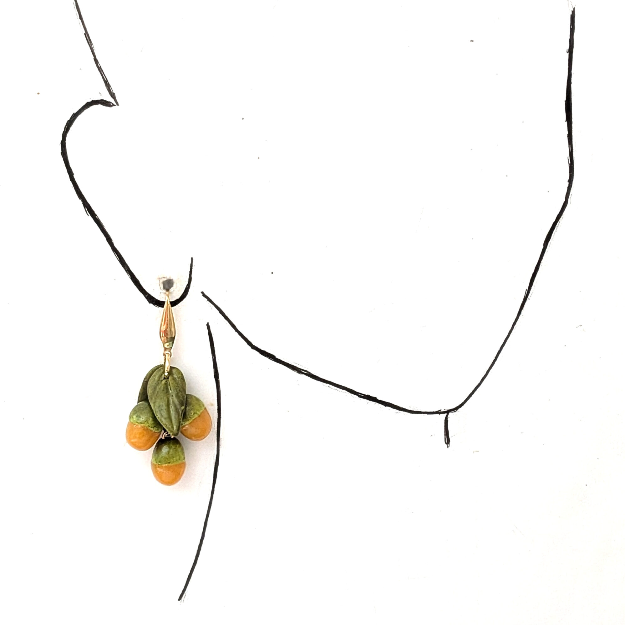 quenepa earrings hanging on ears