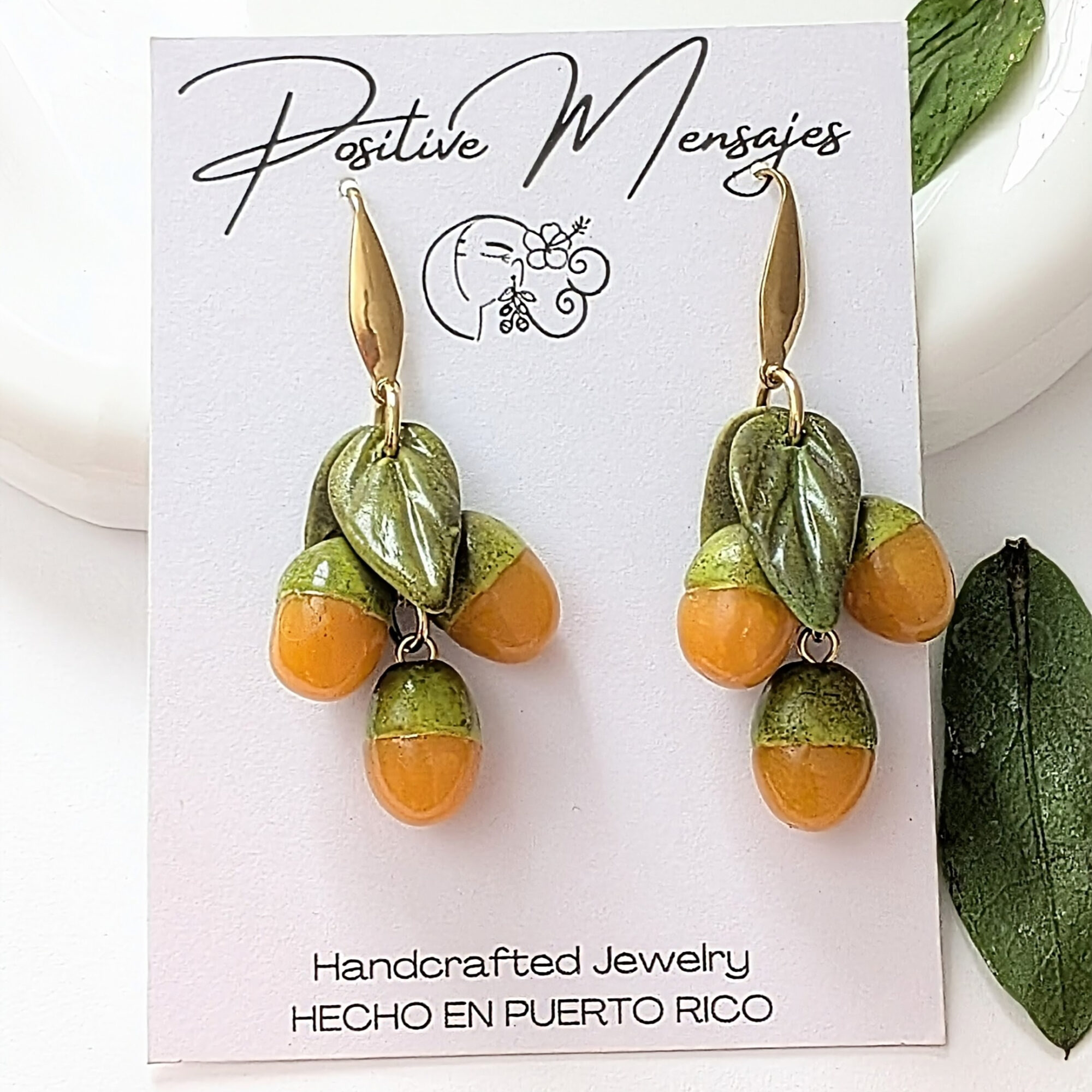 quenepa earrings on white jewelry card