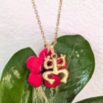 Taíno Coquí Symbol Necklace with Flor de Maga Flower